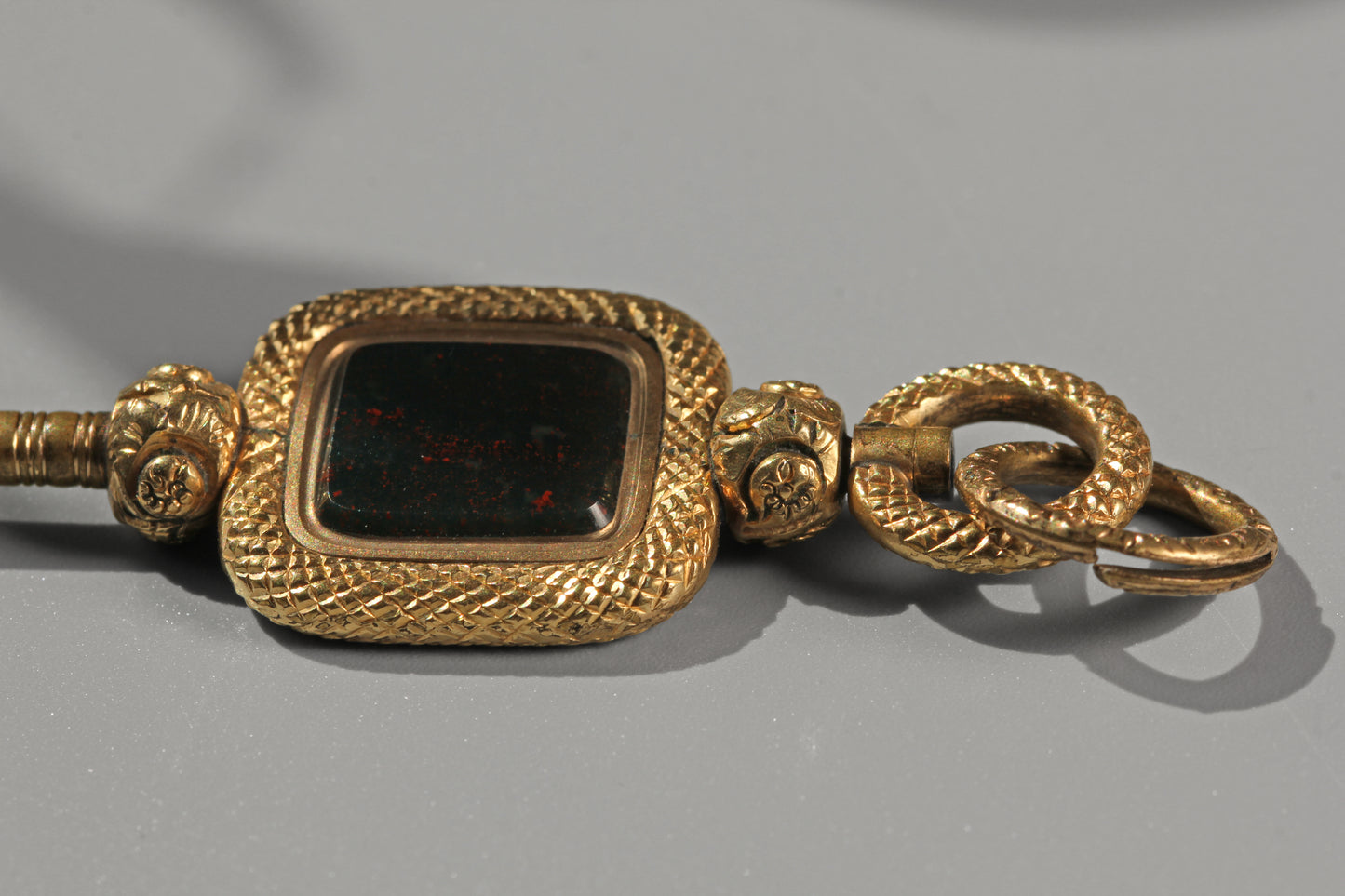 Antique bloodstone watch key with split ring, in 9 carat gold