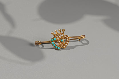 Victorian turquoise and pearl bar pin crafted in 15 carat gold with crowned double heart motif
