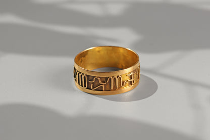 Wide vintage 18ct gold band ring with celestial zodiac symbols
