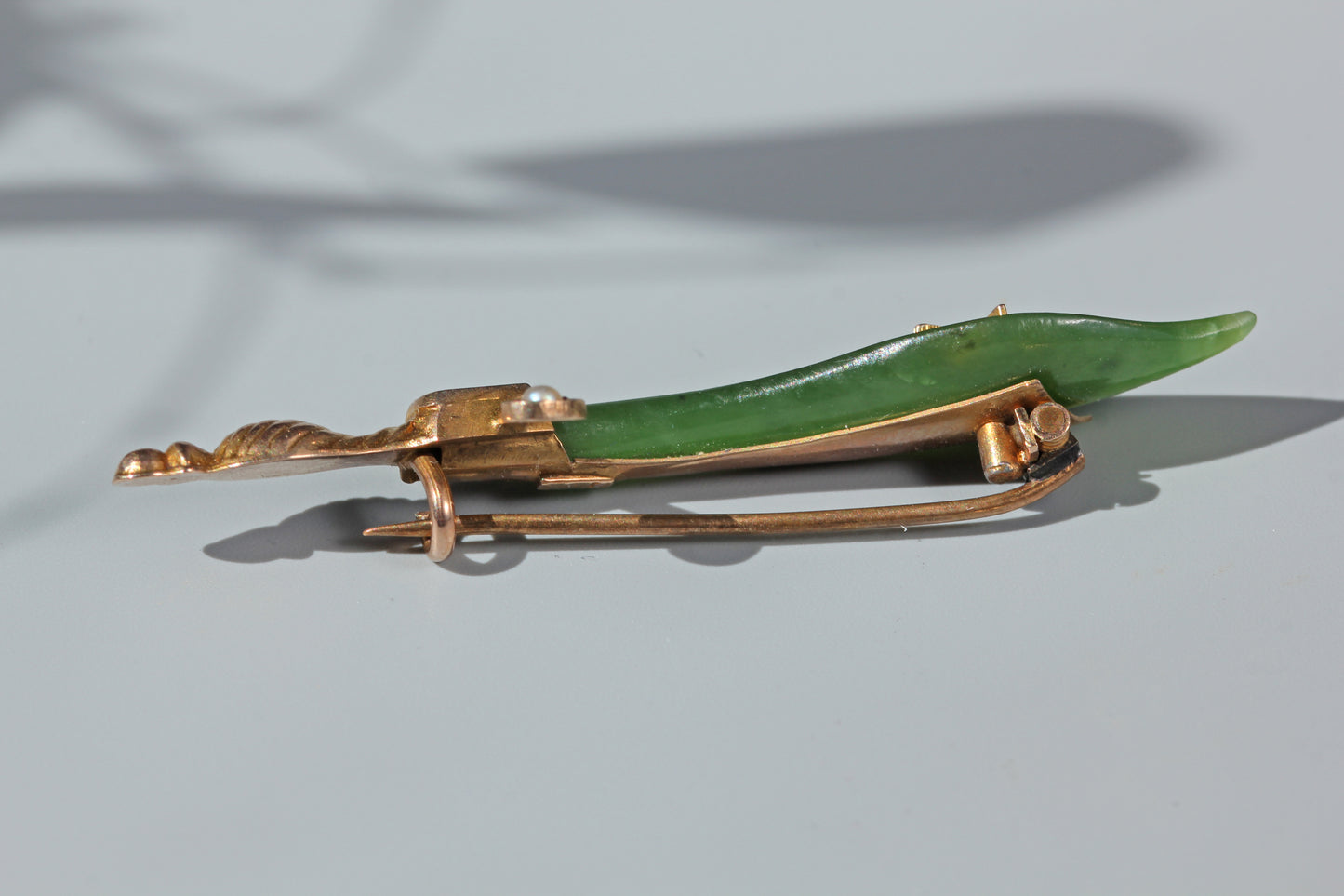 Victorian Orientalist style sword brooch with ruby and pearl accents
