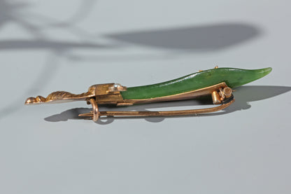 Victorian Orientalist style sword brooch with ruby and pearl accents
