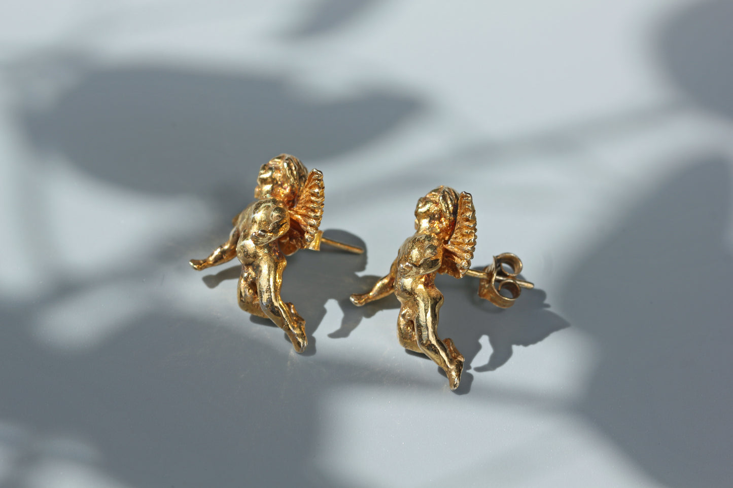 Vintage renaissance cherub stud earrings, in silver gilt