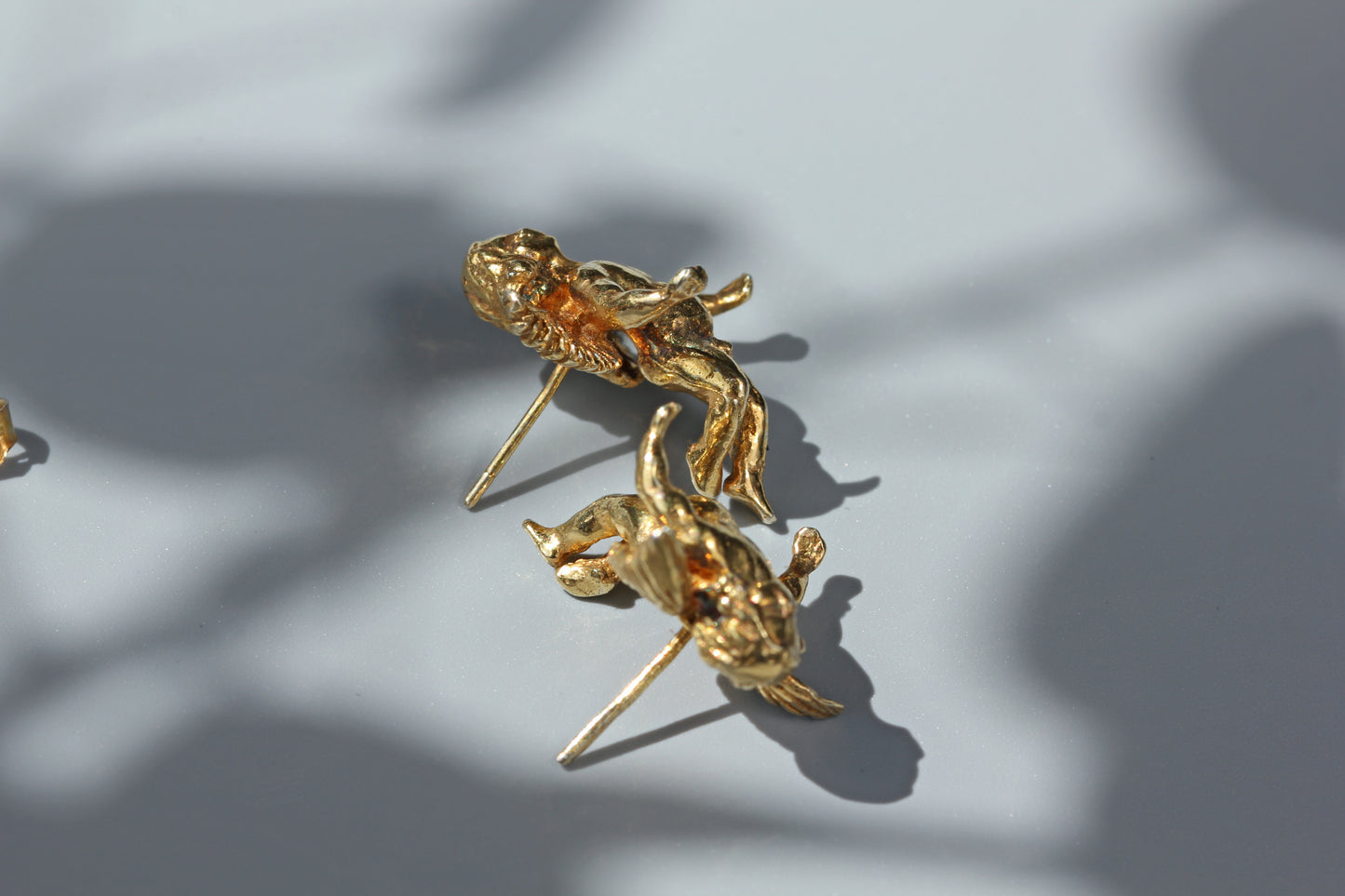 Vintage renaissance cherub stud earrings, in silver gilt