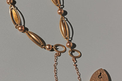 Antique victorian fancy link bracelet with heart padlock, in 9 carat gold