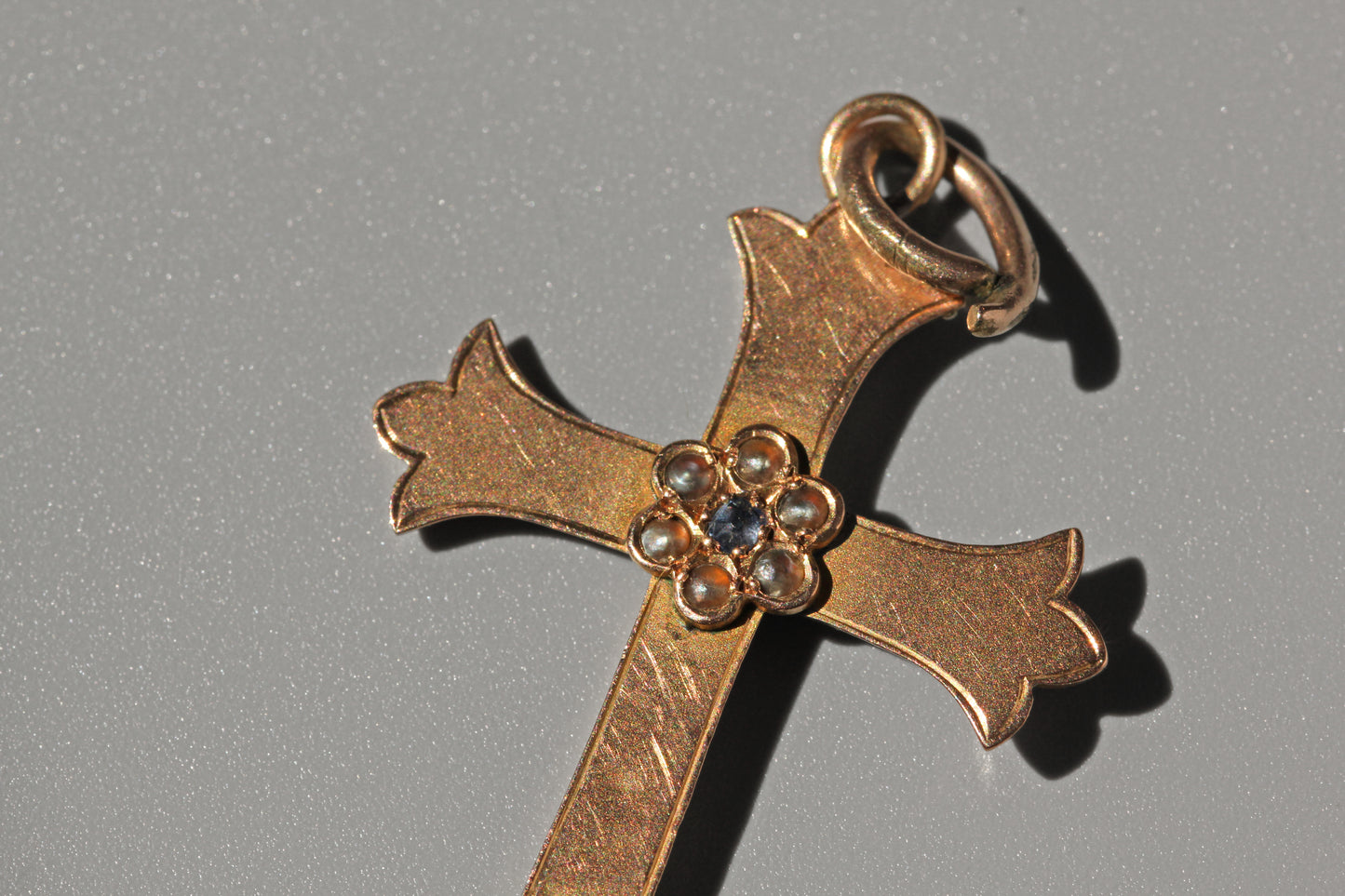 Antique victorian gold crucifix pendant with pearls and sapphire close up view