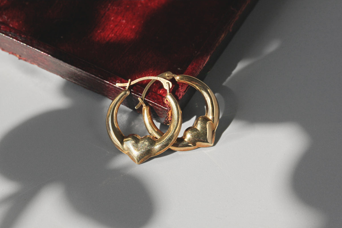 Vintage heart hoop earrings in 9 carat gold on red velvet jewellery box