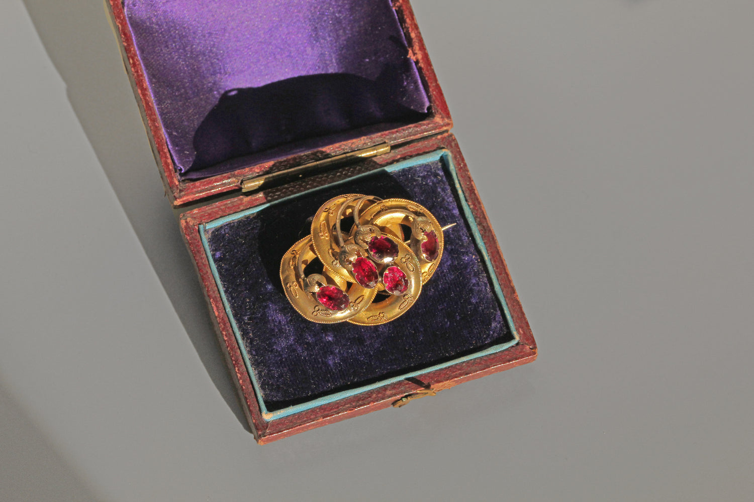 Antique Victorian Etruscan almandine garnet brooch in purple velvet box