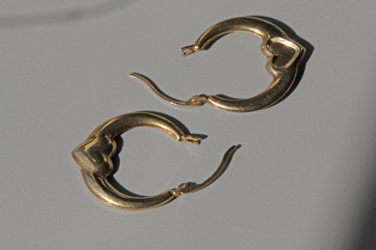 Vintage heart hoop earrings in 9 carat gold side profile close up