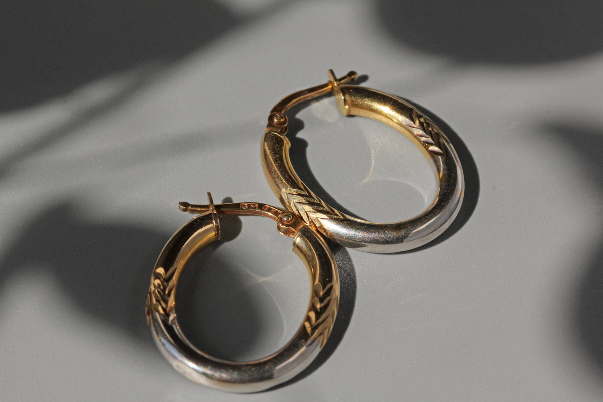 Vintage two-tone creole hoop earrings in 9 carat gold side profile close up