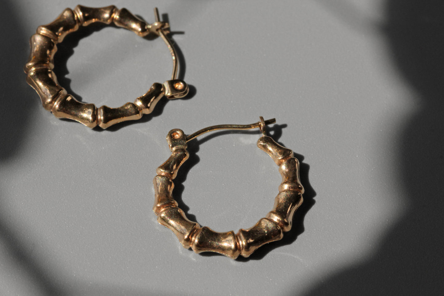 Lightweight gold hoop earrings with bamboo detailing
