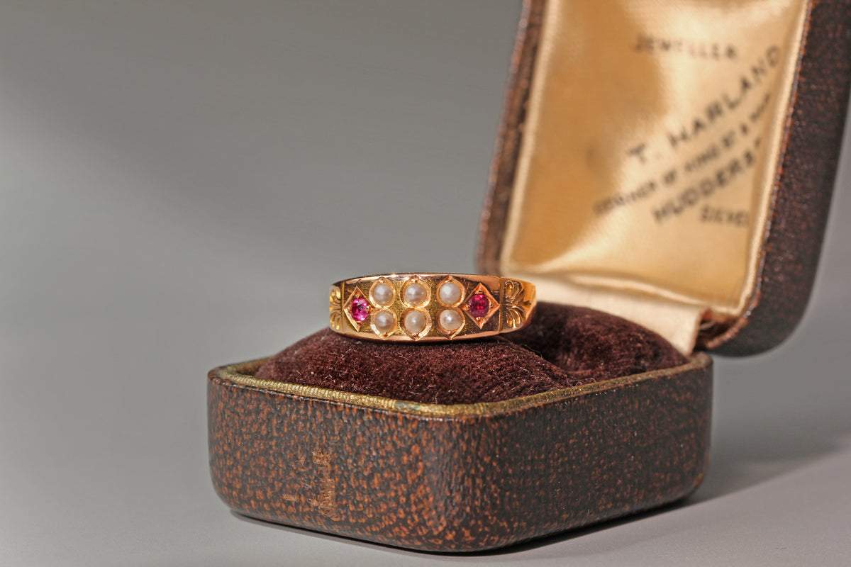 Antique victorian ruby & seed pearl band ring, in 15 carat gold