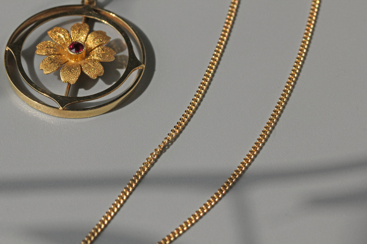 Antique victorian cosmos flower ruby pendant necklace, in 15 carat gold