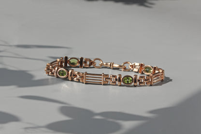 Vintage fancy link albert chain peridot bracelet, in 9 carat gold