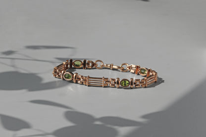 Vintage fancy link albert chain peridot bracelet, in 9 carat gold