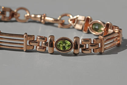 Vintage fancy link albert chain peridot bracelet, in 9 carat gold
