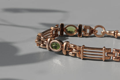 Vintage fancy link albert chain peridot bracelet, in 9 carat gold