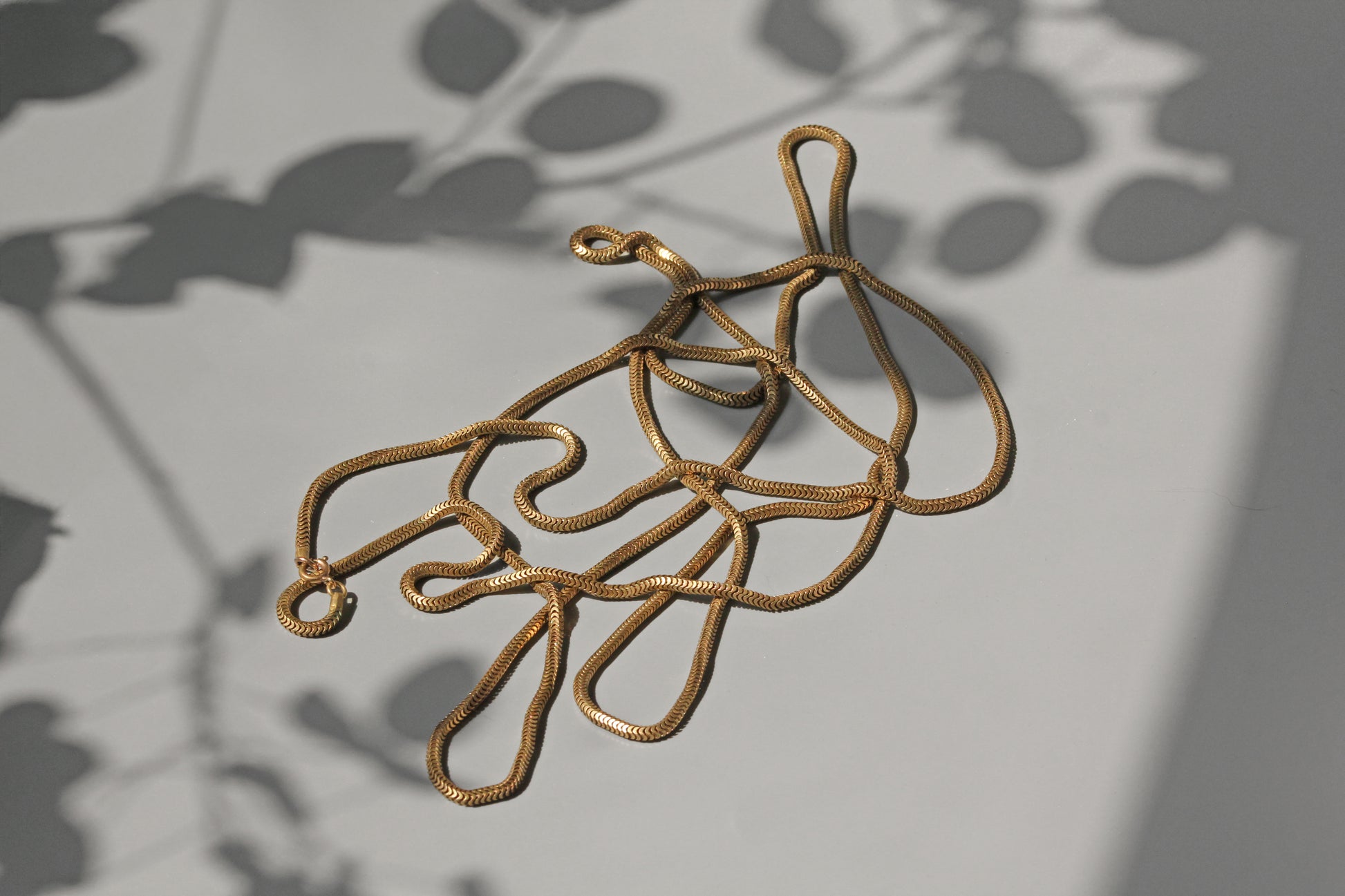 Antique long guard muff chain, snake link in gold
