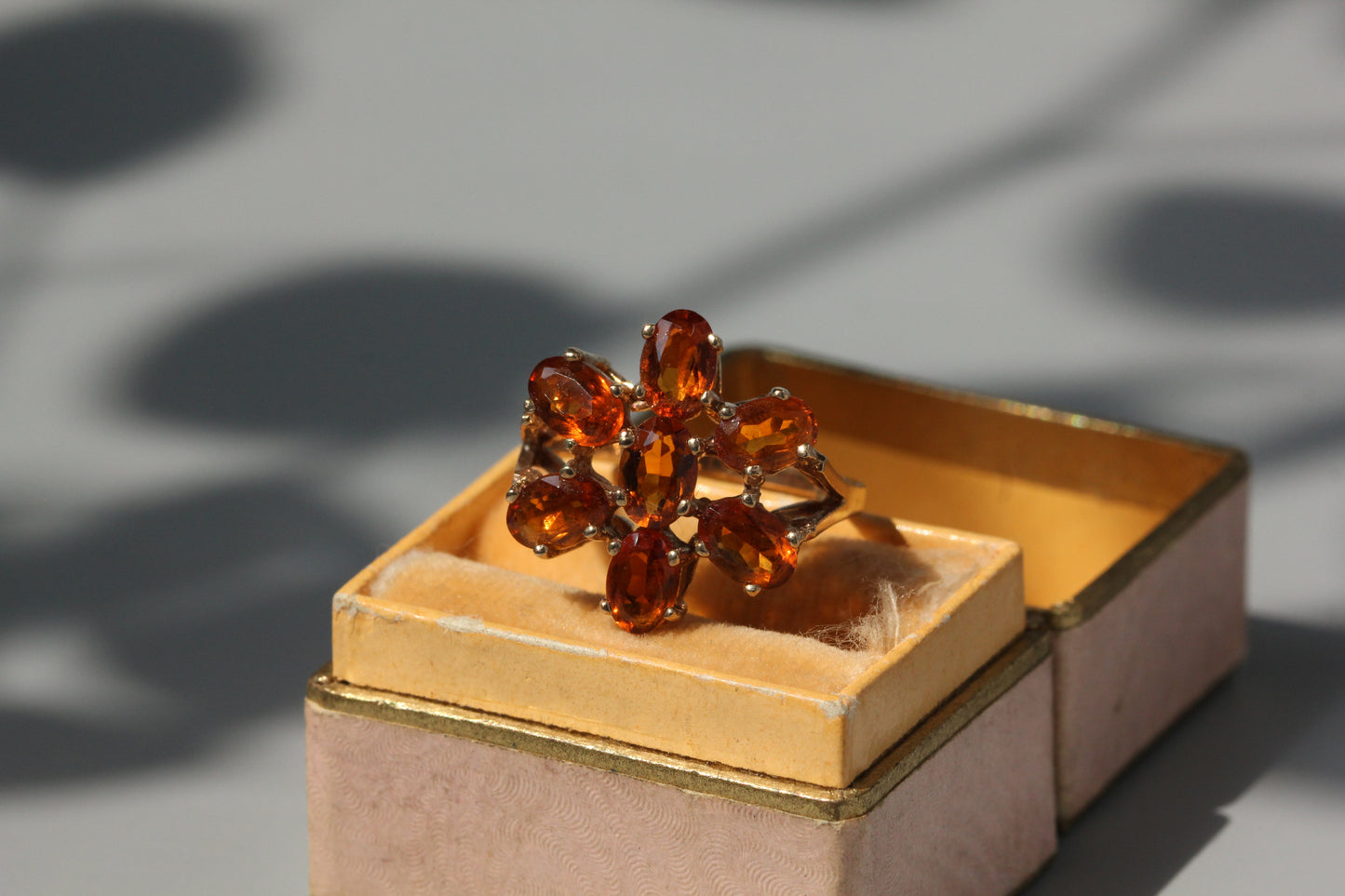 Vintage orange topaz flower cluster ring, in 9 carat gold