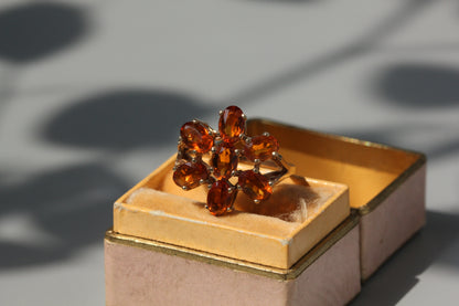 Vintage orange topaz flower cluster ring, in 9 carat gold