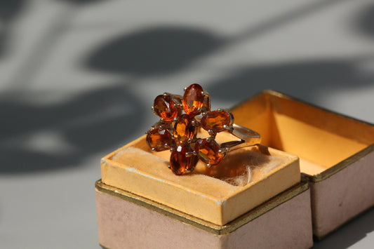 Vintage orange topaz flower cluster ring, in 9 carat gold