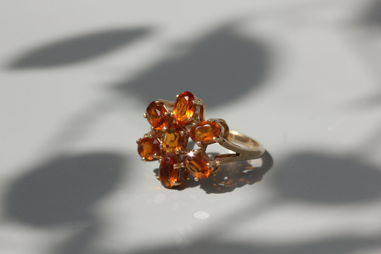 Vintage orange topaz flower cluster ring, in 9 carat gold