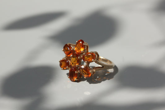 Vintage orange topaz flower cluster ring, in 9 carat gold