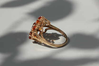 Vintage orange topaz flower cluster ring, in 9 carat gold