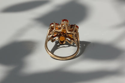 Vintage orange topaz flower cluster ring, in 9 carat gold