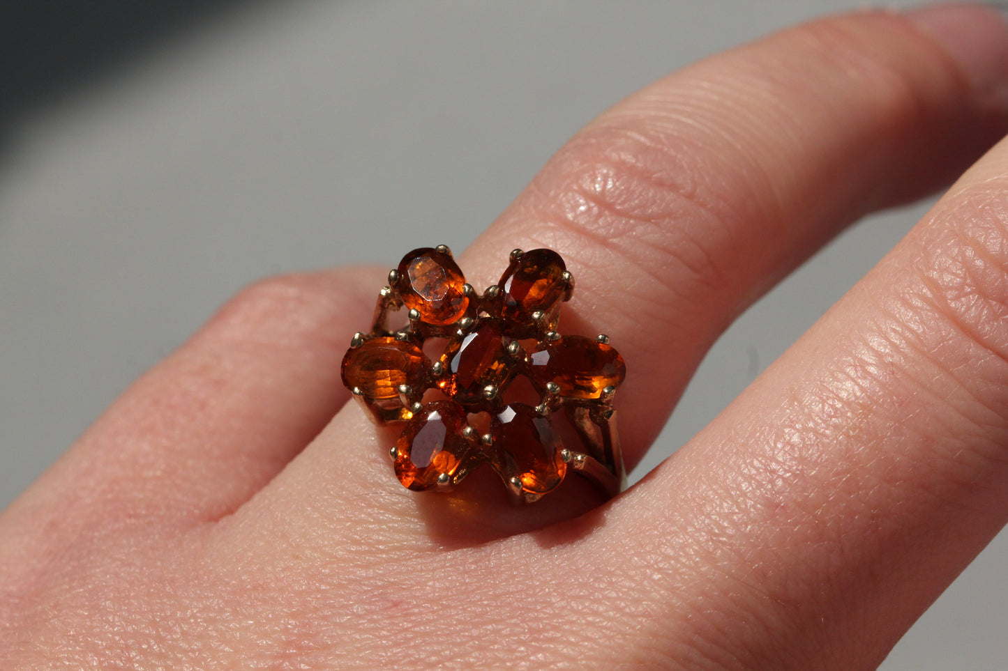 Vintage orange topaz flower cluster ring, in 9 carat gold