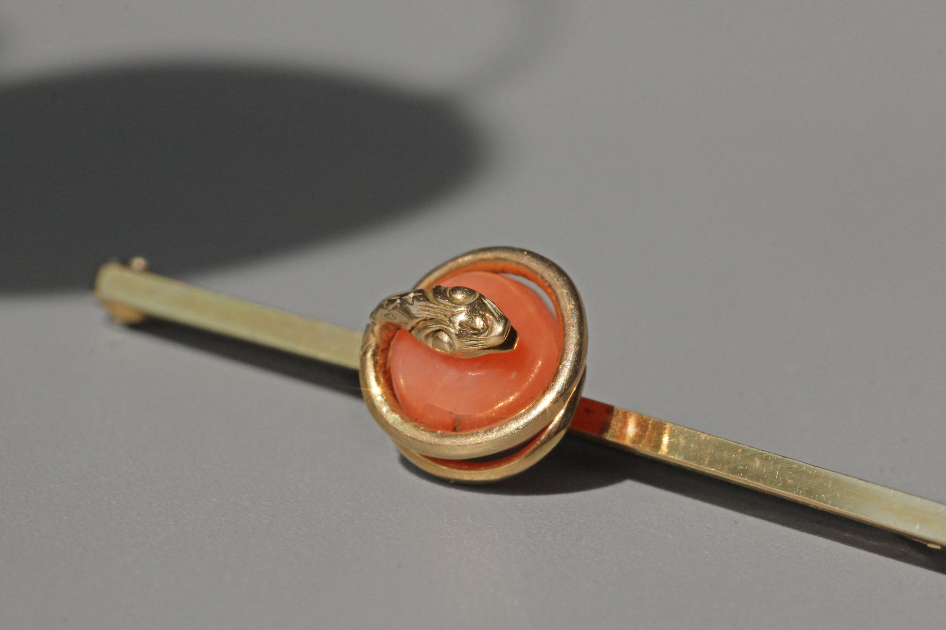 Antique Victorian coral serpent snake brooch in 9 carat gold close up
