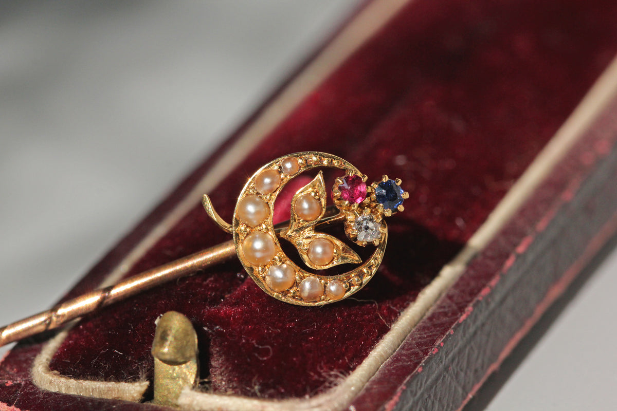 Antique Victorian trefoil crescent moon pin in 18 carat gold in antique red velvet jewellery box