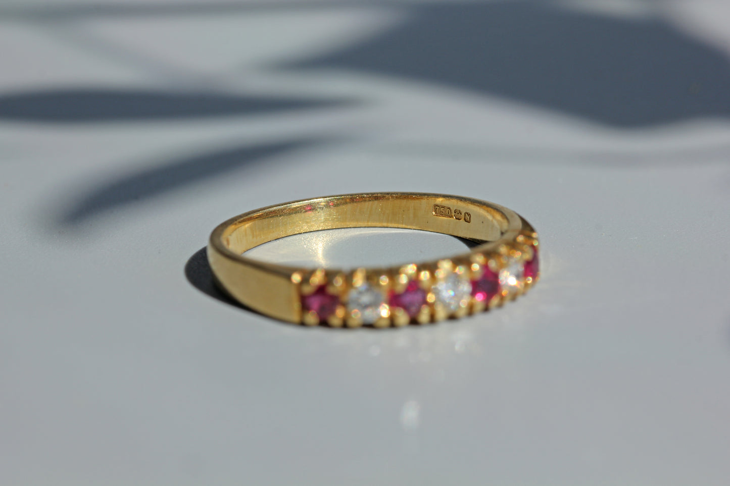 Vintage ruby & diamond half eternity ring, in 18ct gold