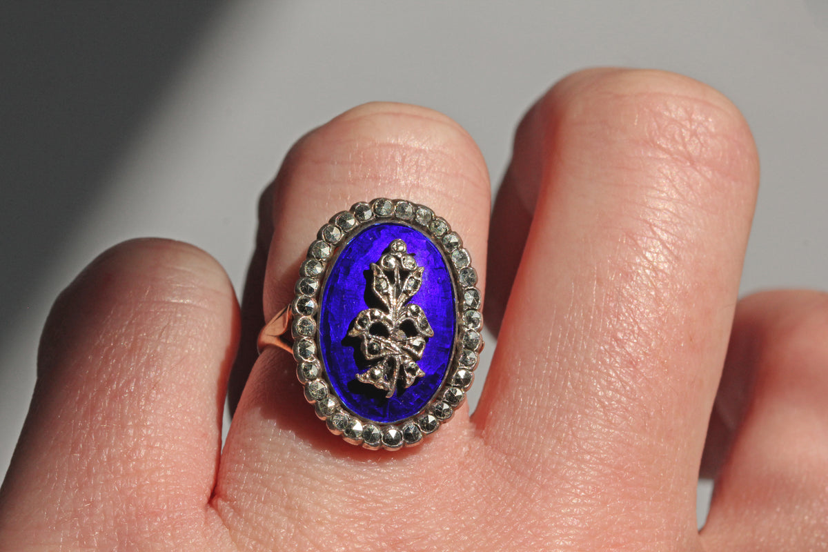 Victorian antique blue enamel marcasite ring in 9ct gold on finger