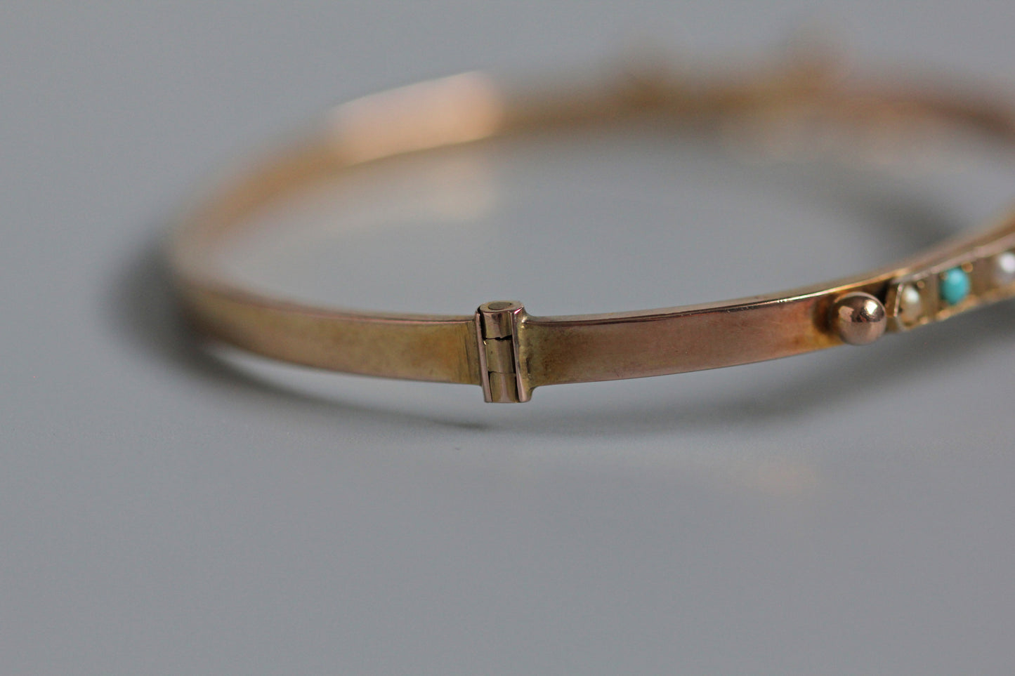 Antique turquoise and pearl ivy or clover bangle, in 9 carat gold