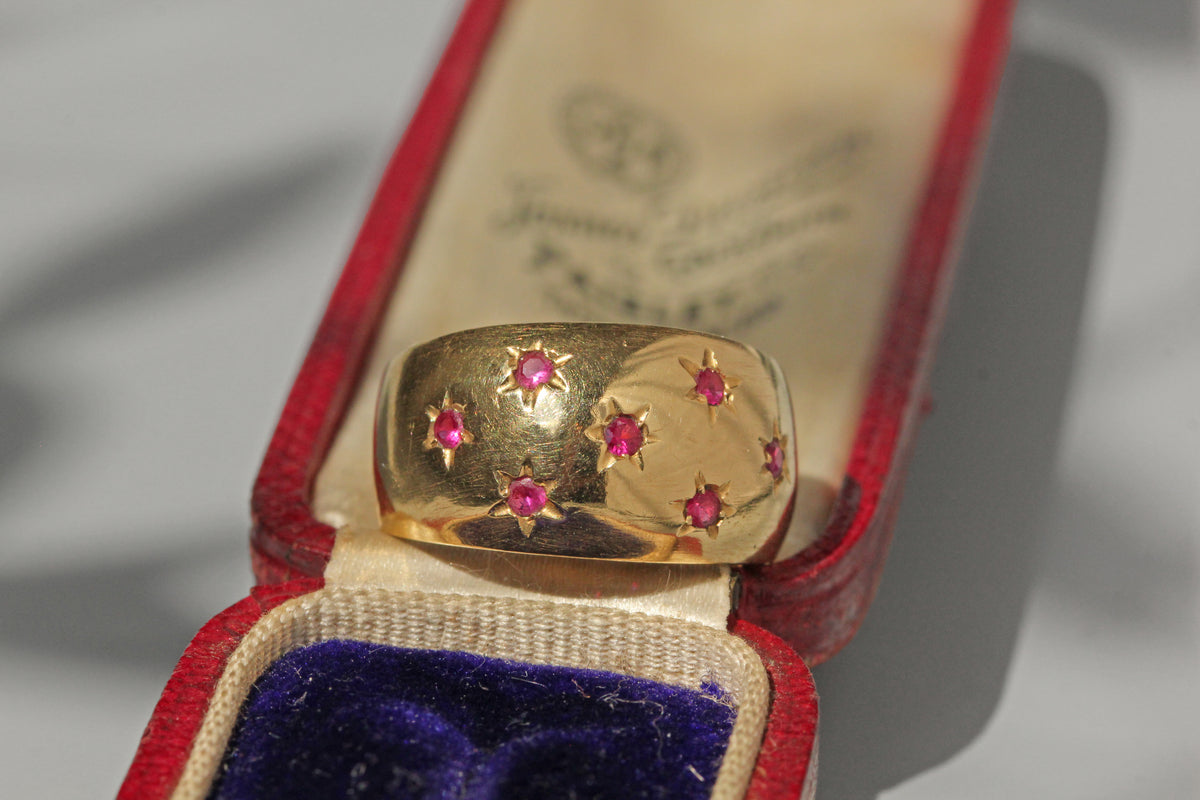 Vintage chunky celestial star set ruby ring, in 18 carat gold