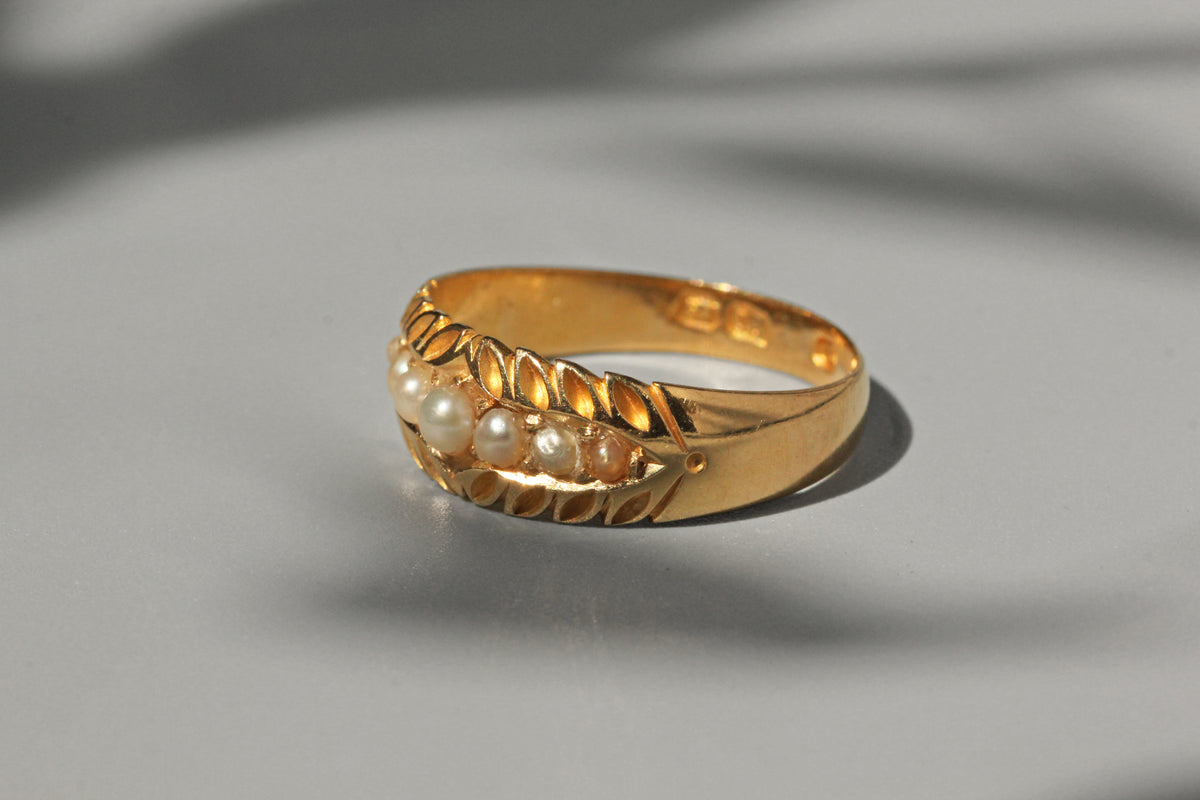 Victorian antique pearl band ring in 18ct gold side view