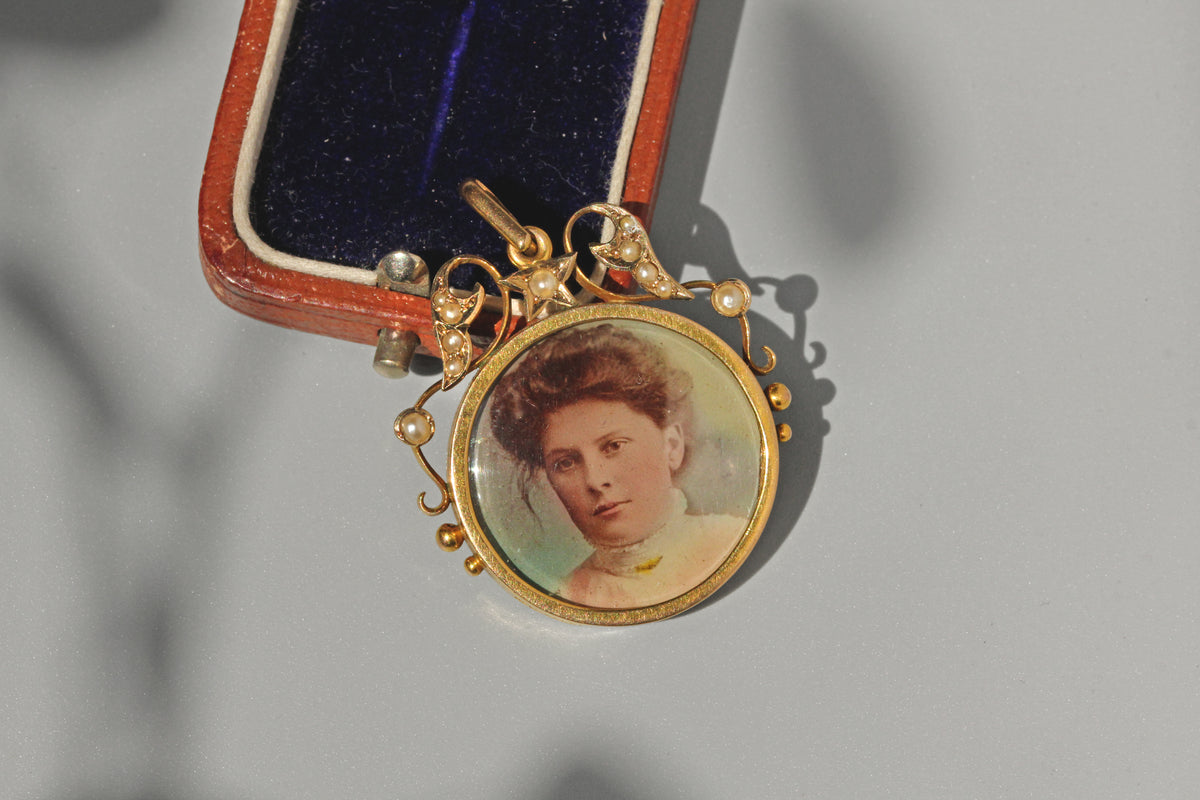 Antique Victorian jewellery celestial pearl double locket pendant in 9 carat gold in antique jewellery box