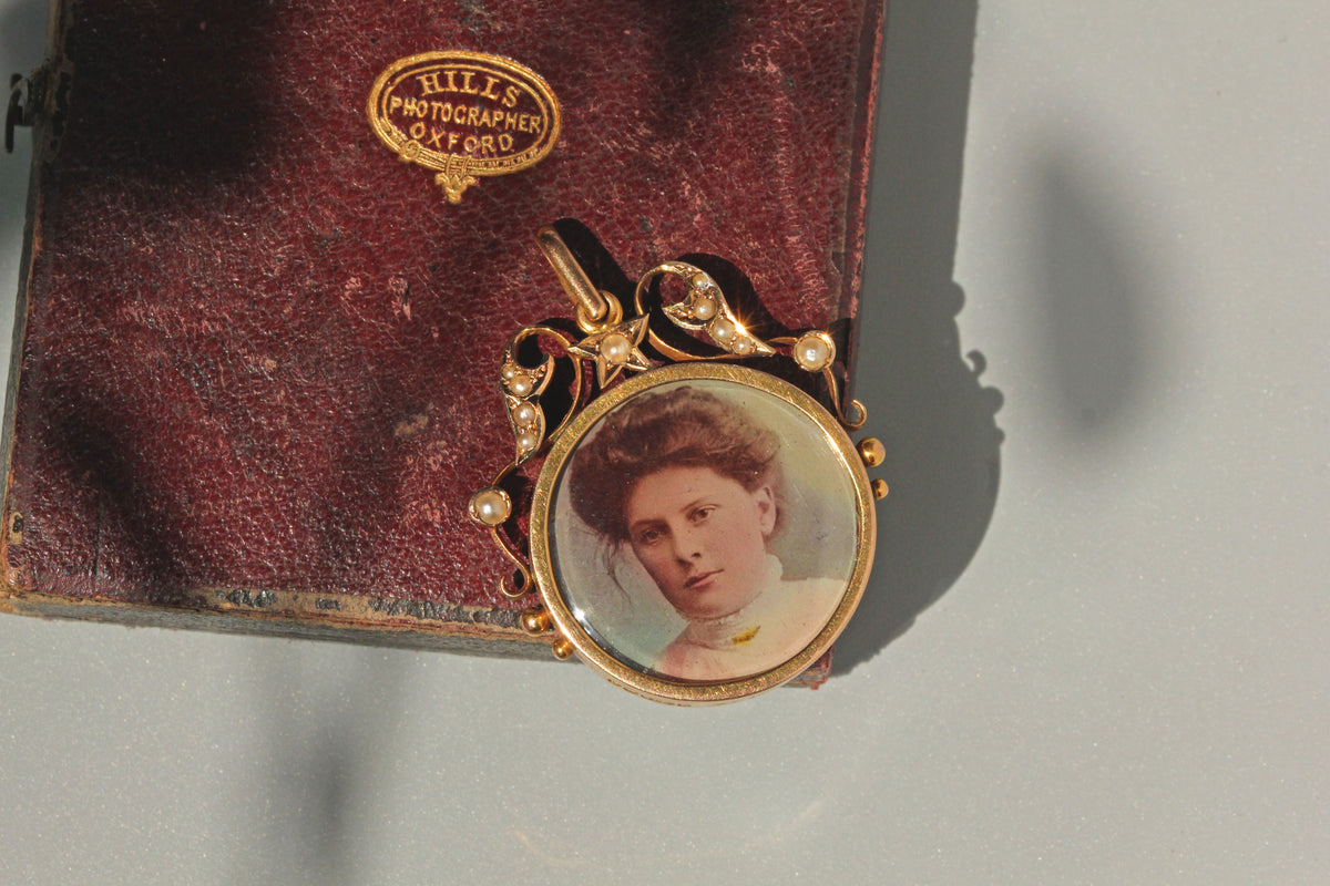 Antique celestial pearl double locket pendant in 9 carat gold on daguerreotype