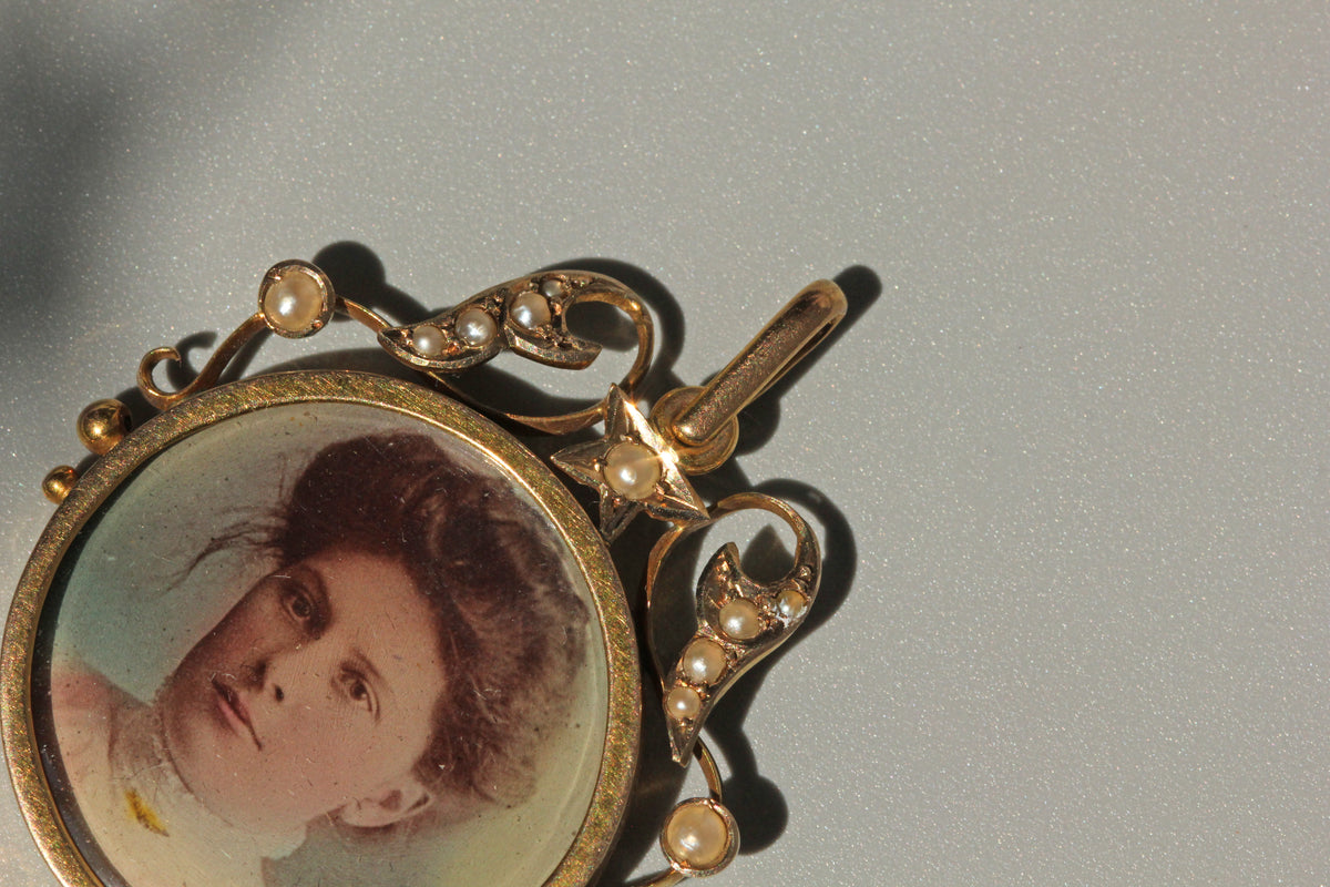 Antique celestial pearl double locket pendant in 9 carat gold with hand painted portrait