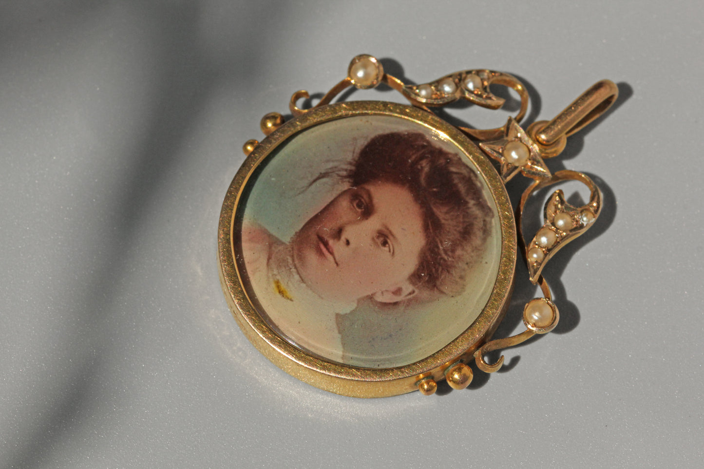 Antique celestial pearl double locket pendant, in 9 carat gold