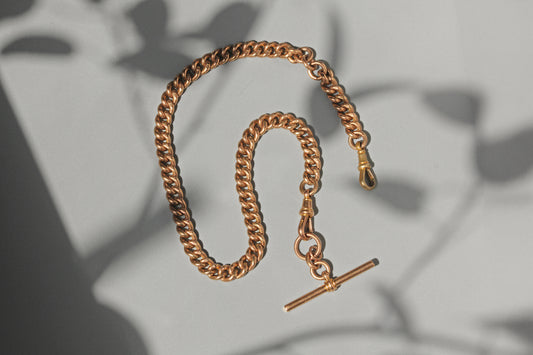 Antique curb link albert chain with tbar, in 9 carat gold
