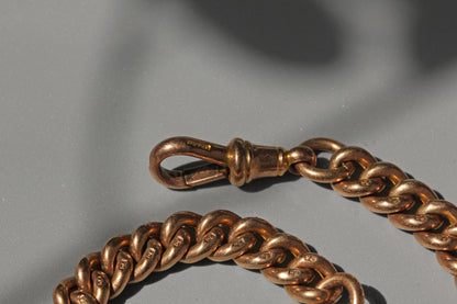 Antique curb link albert chain with tbar, in 9 carat gold