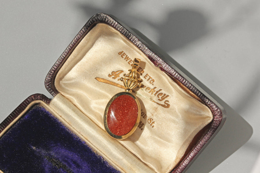 Vintage goldstone fob pendant in 9 carat gold in antique jewellery box