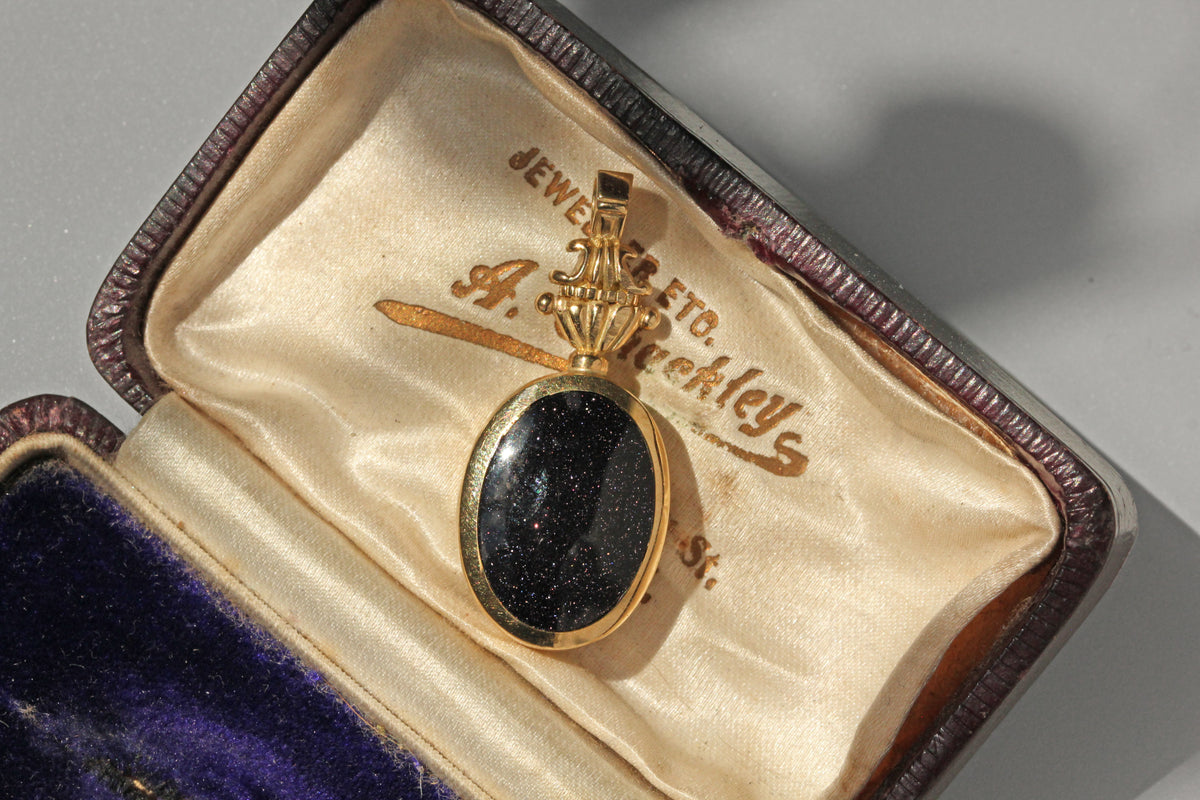 Vintage goldstone fob pendant in 9 carat gold in blue velvet box