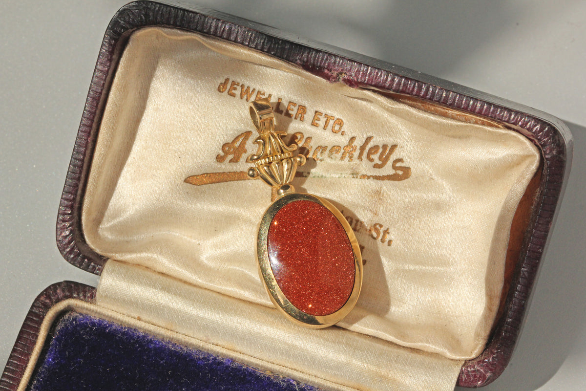 Vintage goldstone fob pendant in 9 carat gold in antique box