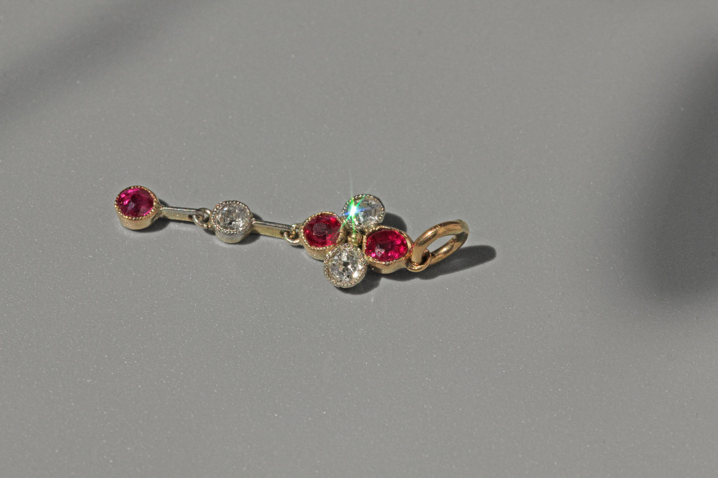 Antique art deco old cut diamond and ruby pendant, in 9 carat gold