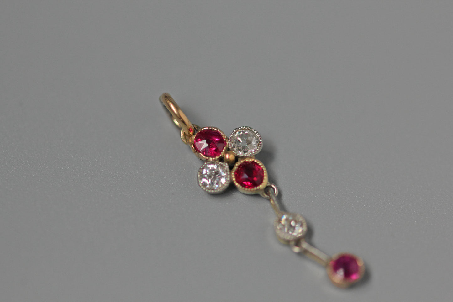 Antique art deco old cut diamond and ruby pendant, in 9 carat gold