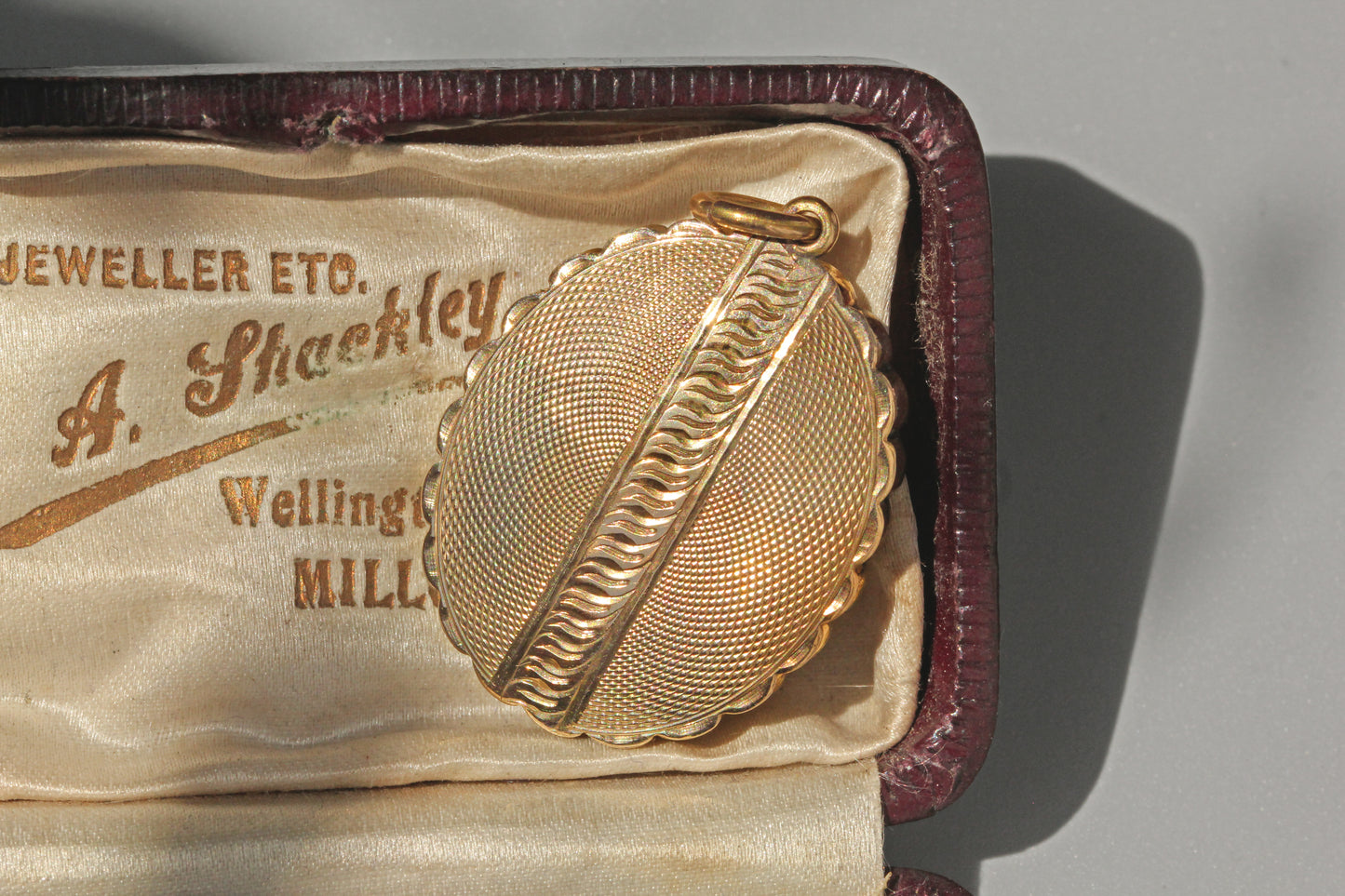 Close up of engine turned Victorian belt buckle locket