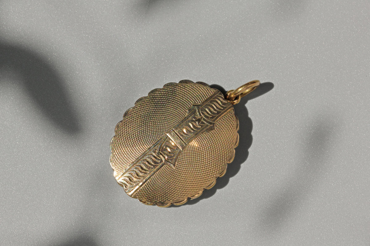 Victorian double photo locket with etched reverse
