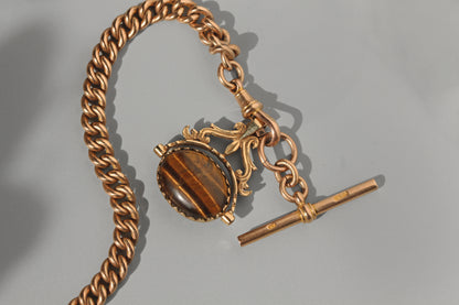 Vintage spinning fob with tigers eye and onyx, in 9 carat gold